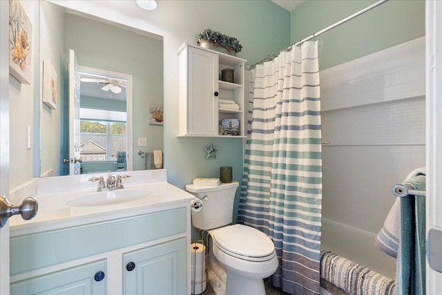 bathroom featuring shower / bath combo, vanity, and toilet