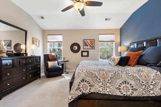 bedroom with multiple windows, visible vents, and light colored carpet