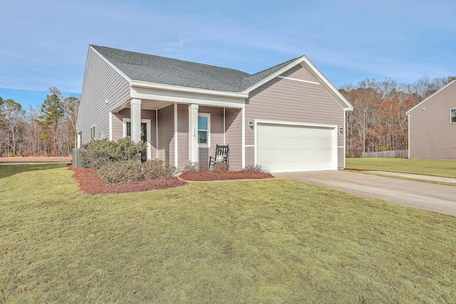 view of front facade with a garage, a porch, and a front lawn