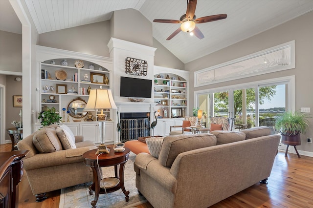 3948 Gift Blvd, Johns Island, SC 29455 - living room with ceiling fan, built in shelves, wood finished floors, high vaulted ceiling, and a fireplace