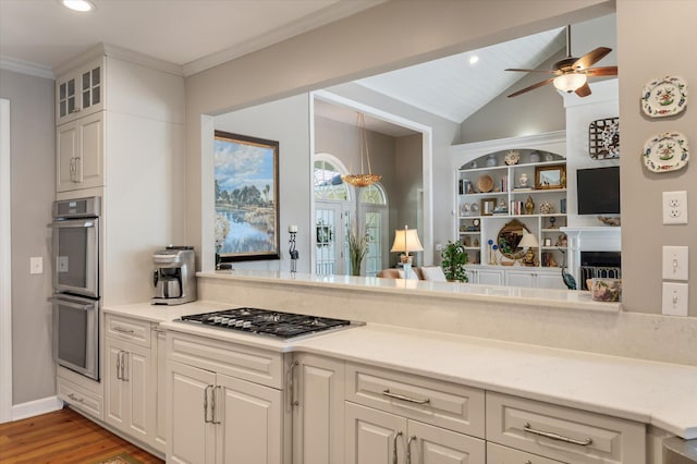3948 Gift Blvd, Johns Island, SC 29455 - kitchen featuring stainless steel appliances, light wood-style floors, white cabinetry, glass insert cabinets, and light countertops
