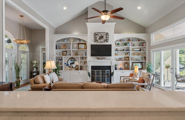 3948 Gift Blvd, Johns Island, SC 29455 - living area featuring built in shelves, a ceiling fan, a fireplace, high vaulted ceiling, and wooden ceiling