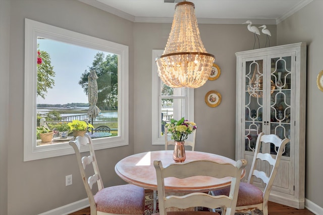 3948 Gift Blvd, Johns Island, SC 29455 - dining room with a chandelier, crown molding, wood finished floors, and baseboards