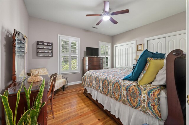 3948 Gift Blvd, Johns Island, SC 29455 - bedroom featuring light wood-type flooring, multiple closets, baseboards, and ceiling fan
