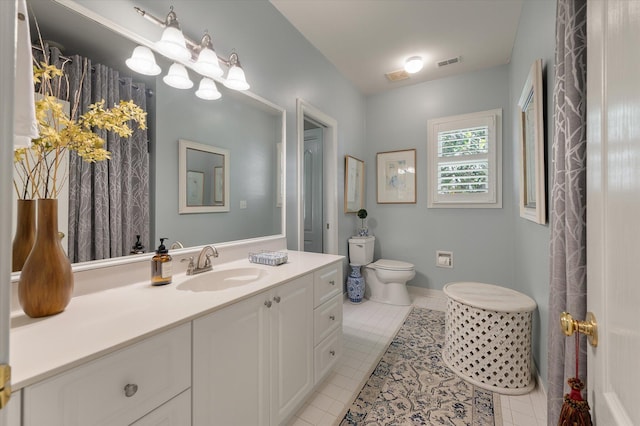 3948 Gift Blvd, Johns Island, SC 29455 - full bathroom with tile patterned flooring, toilet, vanity, and baseboards