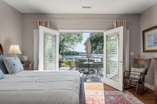 3948 Gift Blvd, Johns Island, SC 29455 - bedroom featuring access to outside, wood finished floors, and a water view