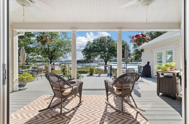 3948 Gift Blvd, Johns Island, SC 29455 - wooden deck featuring a ceiling fan, a water view, and outdoor dining space