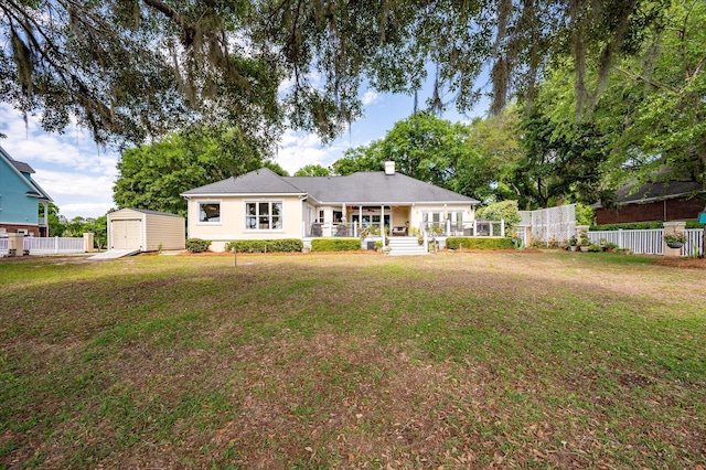 3948 Gift Blvd, Johns Island, SC 29455 - back of property featuring a storage unit, an outdoor structure, covered porch, a garage, and a chimney