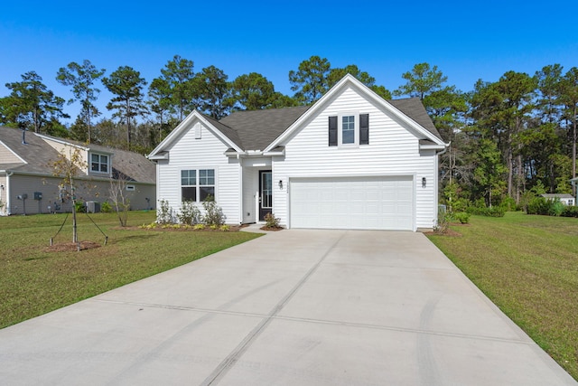 view of front of property featuring a front yard and a garage