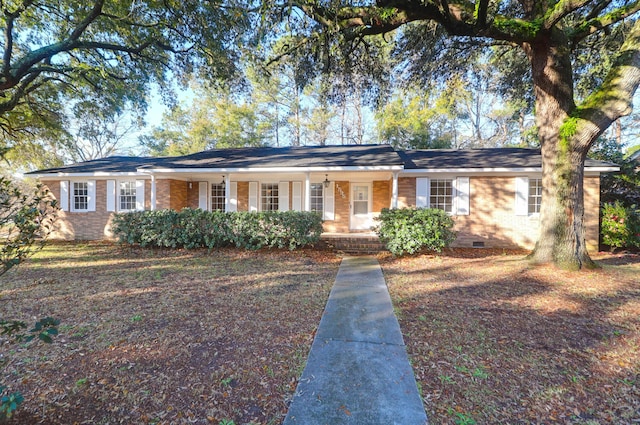 ranch-style home with crawl space, brick siding, and covered porch