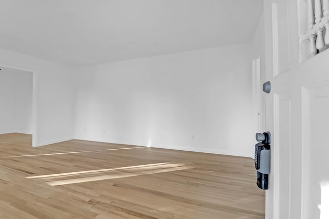 spare room with light wood-style flooring