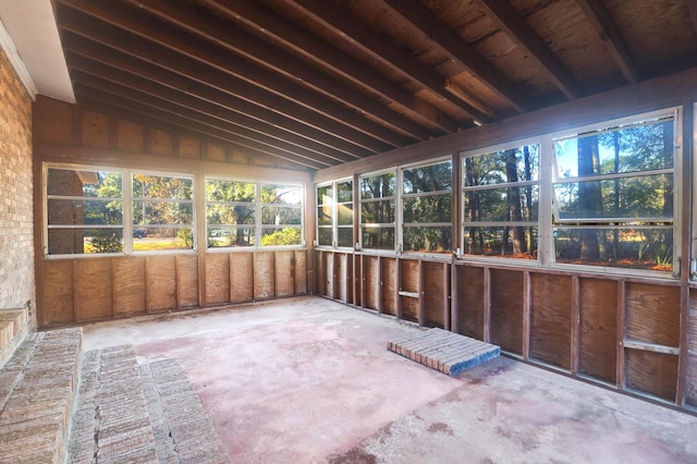 unfurnished sunroom with vaulted ceiling