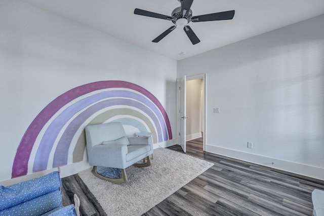 bedroom featuring a ceiling fan, baseboards, and dark wood finished floors