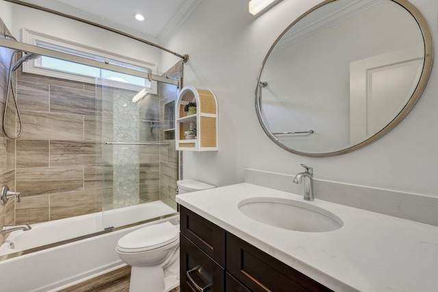 bathroom with toilet, vanity, crown molding, and shower / bathing tub combination