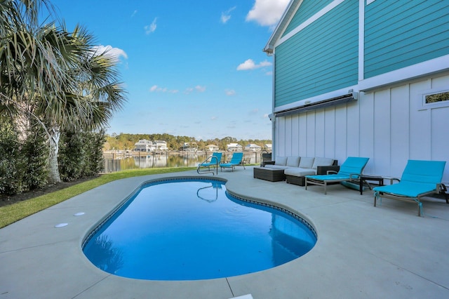 view of swimming pool with outdoor lounge area, a water view, a patio area, and a fenced in pool