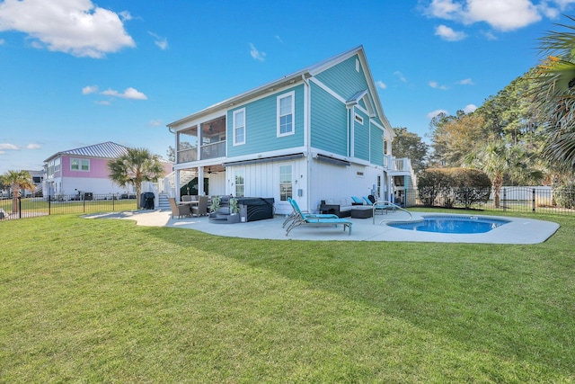back of house with a fenced backyard, a yard, stairs, and a patio