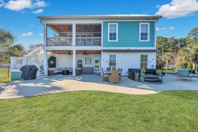 rear view of house featuring an outdoor hangout area, stairs, a patio area, ceiling fan, and a lawn