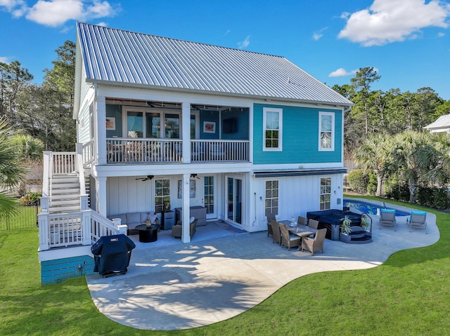 back of house with an outdoor hangout area, stairs, a patio, a ceiling fan, and a yard