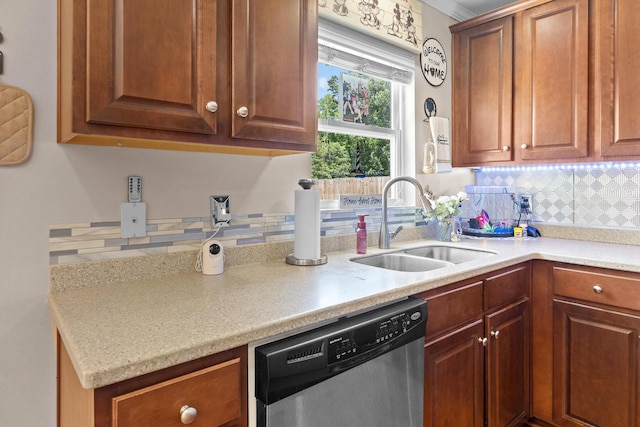 kitchen featuring dishwasher, a sink, backsplash, and light countertops