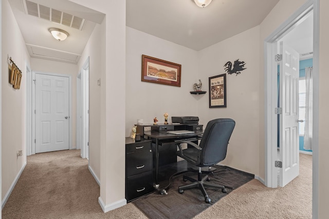 carpeted home office with baseboards and attic access