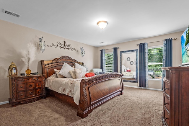 carpeted bedroom featuring baseboards
