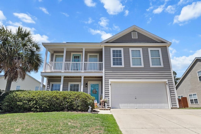 view of front of home featuring a balcony, driveway, an attached garage, and a front lawn