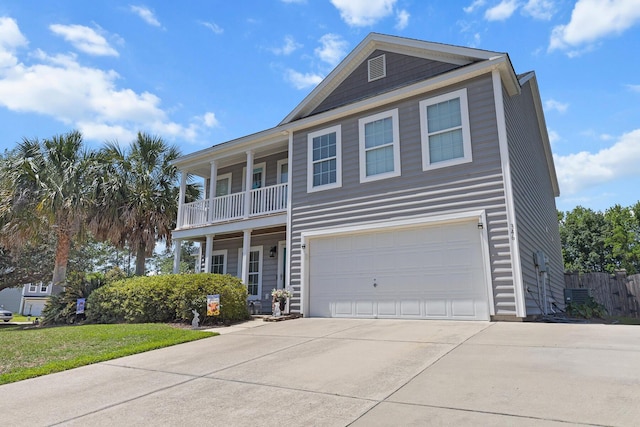 view of front of house featuring driveway, a garage, central AC unit, and a balcony