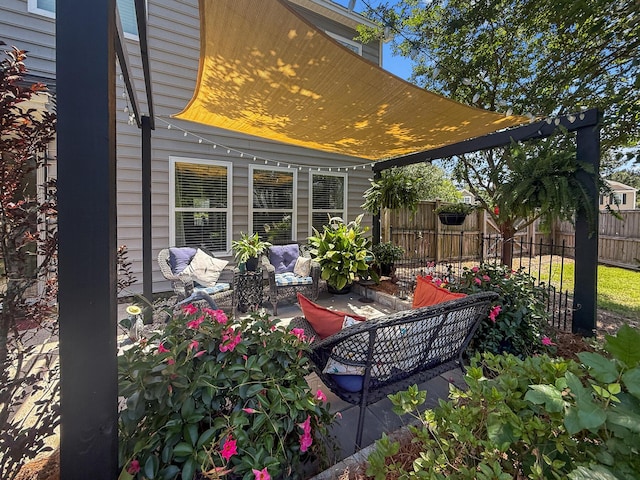 view of patio / terrace featuring fence and an outdoor hangout area