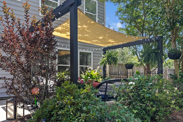 view of side of home with fence
