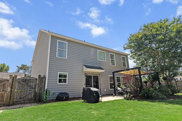 back of property featuring a gate, a patio area, and a pergola