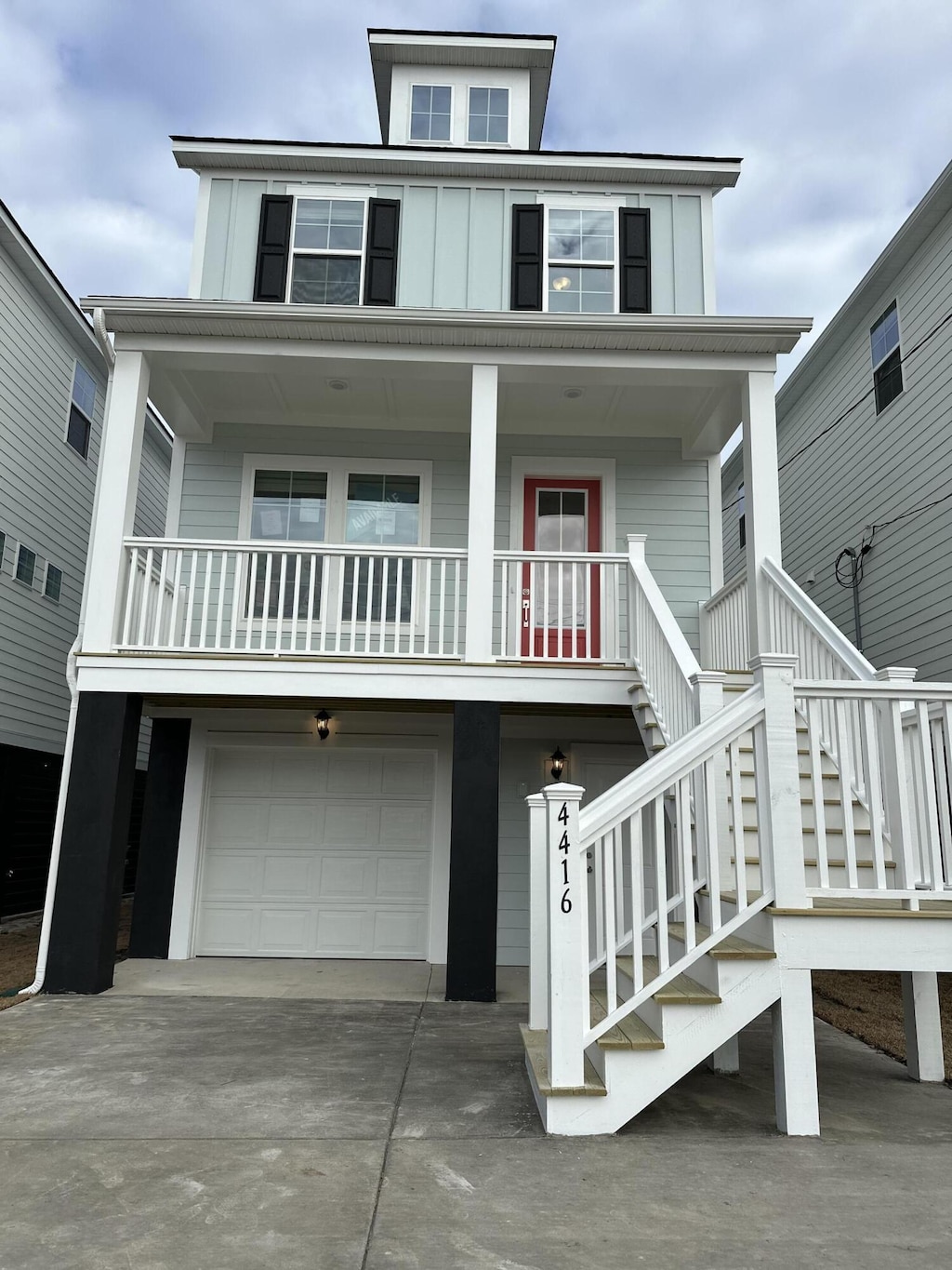 view of front of property featuring covered porch and a garage