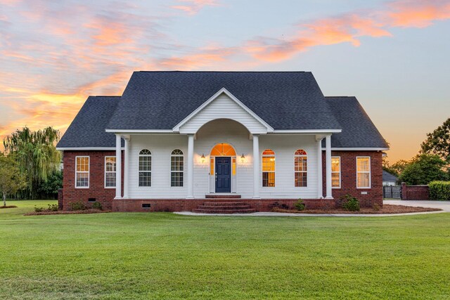 view of front of property with a yard