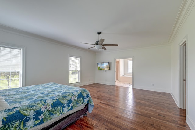 bedroom with crown molding, wood-type flooring, connected bathroom, and ceiling fan