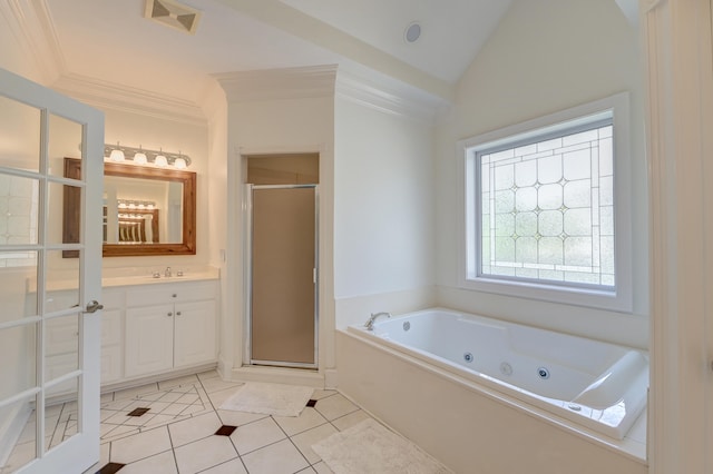 bathroom featuring plus walk in shower, tile patterned flooring, vaulted ceiling, and vanity