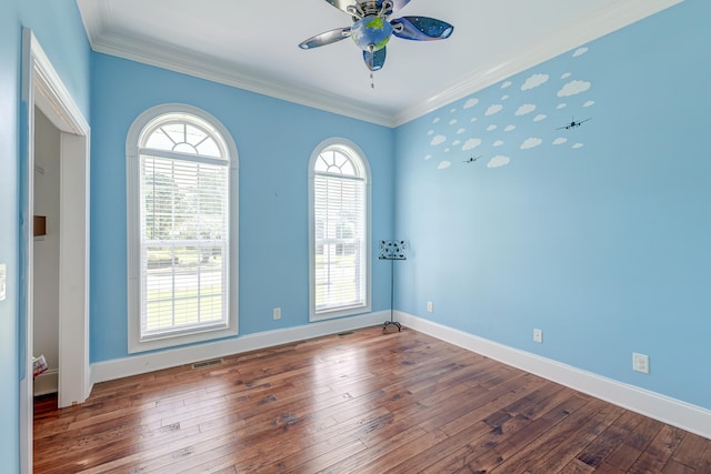 spare room with ceiling fan, dark hardwood / wood-style floors, and ornamental molding