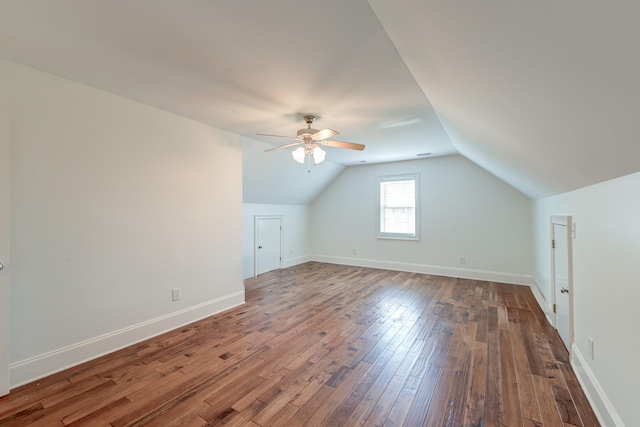 additional living space with ceiling fan, hardwood / wood-style flooring, and vaulted ceiling