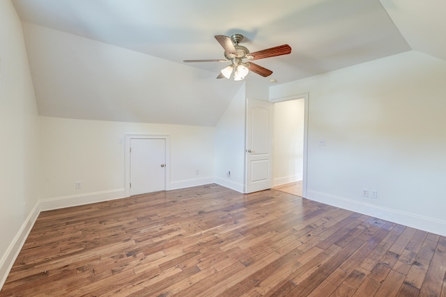 bonus room featuring ceiling fan, hardwood / wood-style floors, and vaulted ceiling