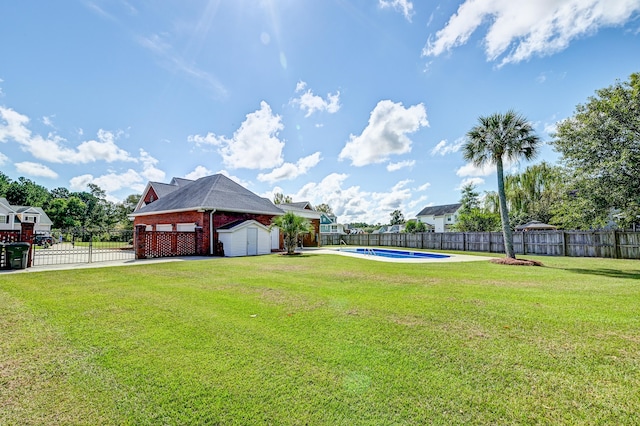 view of yard with a fenced in pool