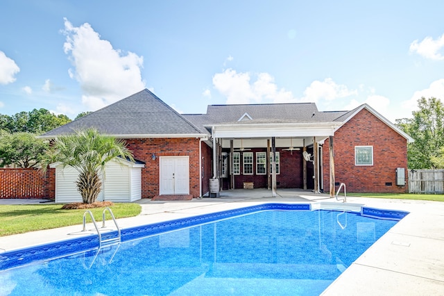 view of swimming pool with a patio and french doors