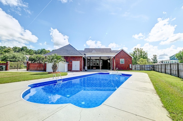 view of pool with a lawn