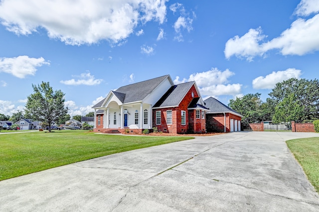 view of front of house featuring a front lawn and a garage