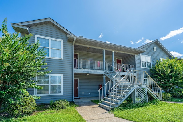 2601 Riverridge Ct Unit A, Moncks Corner, SC 29461 - view of front of house featuring stairs, covered porch, and a front lawn