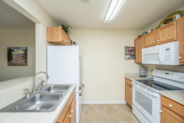2601 Riverridge Ct Unit A, Moncks Corner, SC 29461 - kitchen featuring white appliances, light countertops, a textured ceiling, and brown cabinets