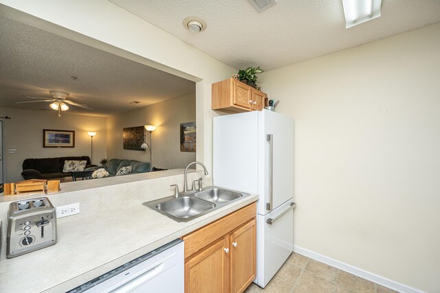 2601 Riverridge Ct Unit A, Moncks Corner, SC 29461 - kitchen featuring white appliances, light countertops, a textured ceiling, open floor plan, and a ceiling fan