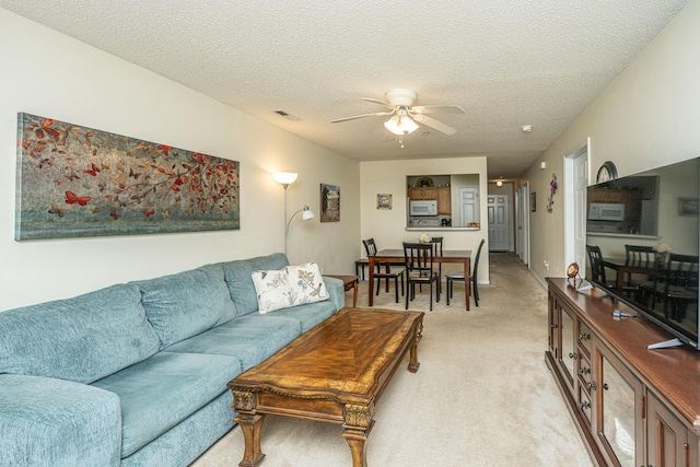 2601 Riverridge Ct Unit A, Moncks Corner, SC 29461 - living room with a ceiling fan, light colored carpet, and a textured ceiling