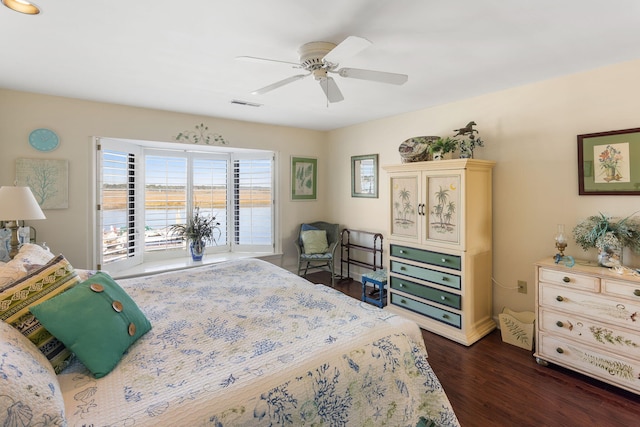 bedroom featuring access to outside, ceiling fan, and dark hardwood / wood-style flooring