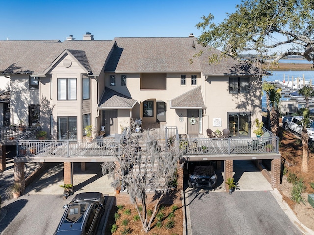 rear view of property featuring a carport