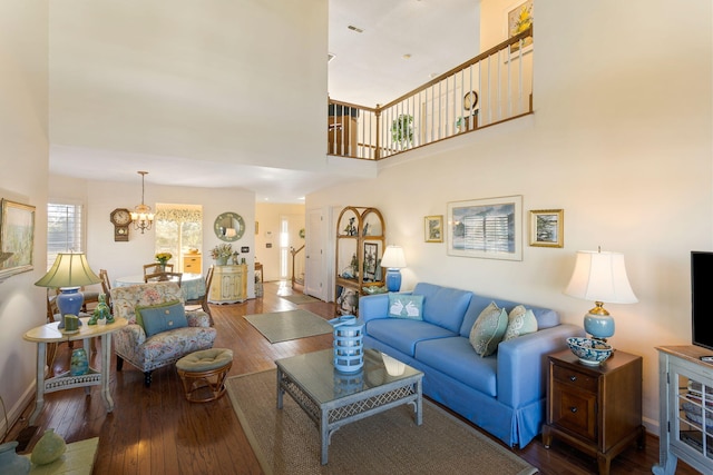 living room with hardwood / wood-style floors and a chandelier