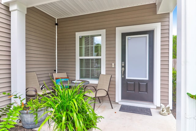 doorway to property with covered porch