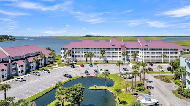 birds eye view of property with a water view